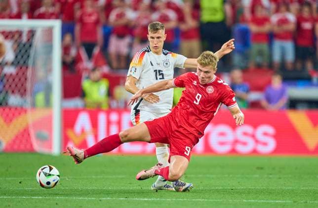 Joshua Kimmich, DFB 6 compete for the ball, tackling, duel, header, zweikampf, action, fight against Rasmus Hoejlund, Höjlund, DEN 9 in the best of 16 match GERMANY - DENMARK of the UEFA European Championships 2024 on Jun 29, 2024 in Dormund, Germany.