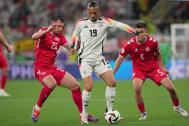 Germany s Leroy Sane fight for the ball with Denmark s Joakim Maehle Denmark s Pierre-Emile Hojbjerg during the Euro 2024 soccer match between Germany and Denmark at the BVB Stadium , Dortmund , Germany - Saturday 29 June 2024. - Soccer .  Copyright: xSpada LaPressex