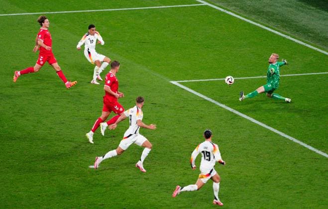 Jamal Musiala of Germany scores the second goal past Kasper Schmeichel of Denmark 2-0 Germany v Denmark, UEFA European Championship, EM, Europameisterschaft 2024, Round of 16, Football, BVB Stadion, Dortmund, Germany - 29 Jun 2024 EDITORIAL USE ONLY No use with unauthorised audio, video, data, fixture lists, club league logos or live services. Online in-match use limited to 120 images, no video emulation. No use in betting, games or single club league player publications. Copyright: xDavexShopland Shutterstockx 14562067v