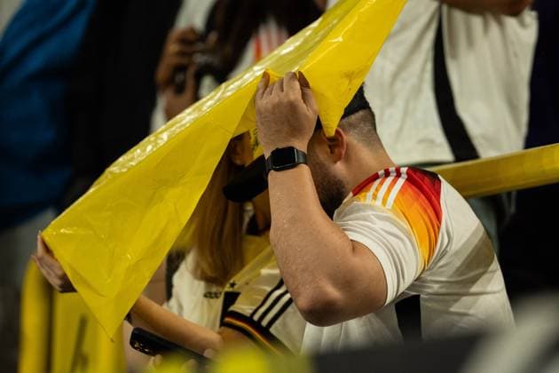 GER, Euro 2024, round of sixteen, Germany Germany, GER vs Denmark Denmark, DNK 29 06 2024, Signal Iduna Park BVB Stadion Dortmund , Dortmund, GER, Euro 2024, round of sixteen, Germany Germany, GER vs Denmark Denmark, DNK In the picture Fans hide from the rain under the tarpaulin nordphotoxGmbHxx xChristianxSchulze nph000300