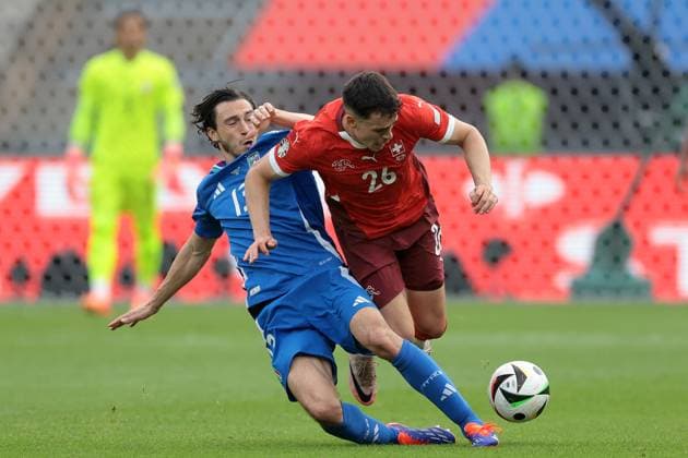 Berlin, Germany, 29th June 2024. Matteo Darmian of Italy clashes with Fabian Rieder of Switzerland during the UEFA European Championships Round of 16 match at Olympiastadion, Berlin. Picture credit should read: Jonathan Moscrop Sportimage EDITORIAL USE ONLY. No use with unauthorised audio, video, data, fixture lists, club league logos or live services. Online in-match use limited to 120 images, no video emulation. No use in betting, games or single club league player publications. SPI-3208-0093