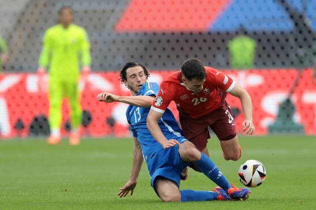 Berlin, Germany, 29th June 2024. Matteo Darmian of Italy clashes with Fabian Rieder of Switzerland during the UEFA European Championships Round of 16 match at Olympiastadion, Berlin. Picture credit should read: Jonathan Moscrop Sportimage EDITORIAL USE ONLY. No use with unauthorised audio, video, data, fixture lists, club league logos or live services. Online in-match use limited to 120 images, no video emulation. No use in betting, games or single club league player publications. SPI-3208-0094