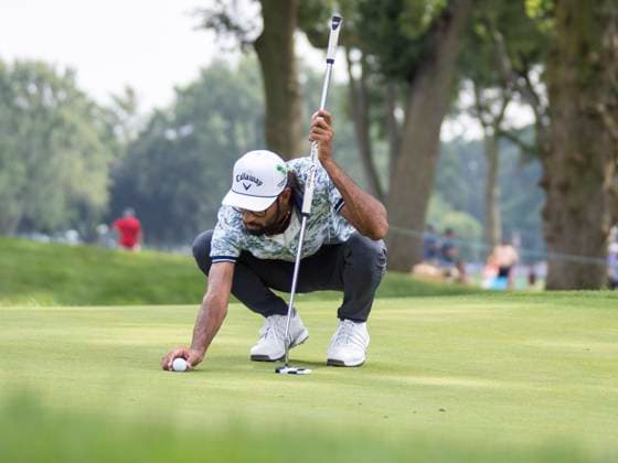 DETROIT, MI - JUNE 29: Akshay Bhatia (USA) places his ball on the green during the third round of the Rocket Mortgage Classic on June 29, 2024 at Detroit Golf Club in Detroit, Michigan. (Photo by Joseph Weiser Icon Sportswire) GOLF: JUN 29 PGA, Golf Herren Rocket Mortgage Classic EDITORIAL USE ONLY Icon2406290473