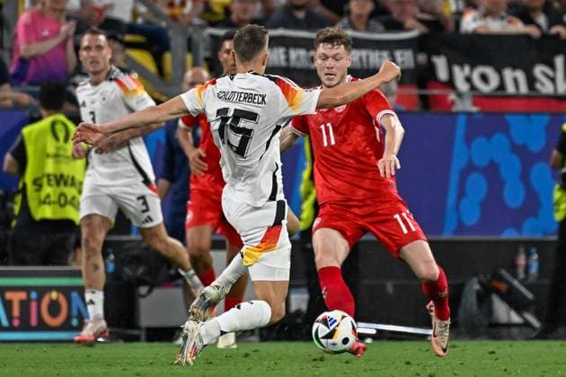 from left in duel Nico Schlotterbeck 15 Germany Andreas Skov Olsen 11 Denmark 29 06 2024 European Football Championship in Germany Germany vs Denmark, Signal Iduna Park, Dortmund, NRW Germany Copyright: xpepphotox xHorstxMauelshagenx pep00321, pep_20240629_hm