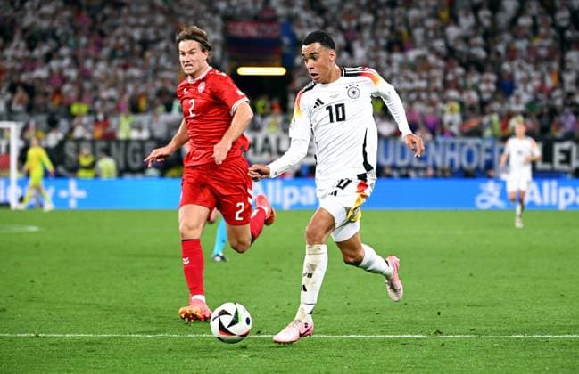 Football, European Championship, EURO 2024, Round of 16, Signal Iduna Park Dortmund Germany Denmark 2 0 Jamal Musiala GER on his way to 2 0 against Joachim Andersen DEN Action