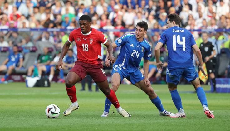 Dan Ndoye in a duel with Andrea Cambiaso, Federico Chiesa Match scene Action Sport Football European Football Championship Euro 2024 European Championship Men Season 2023 2024 29 06 2024 Switzerland SUI vs Italy ITA in Berlin DFL regulations prohibit any use of photographs as image sequences and or quasi video