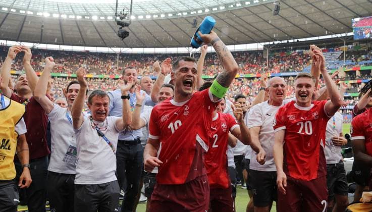 in front Granit Xhaka, Michel Aebischer, Swiss team cheers after the end of the match, celebrates victory in front of the fans Sports Football Soccer European Championship Euro 2024 European Championship Men Season 2023 2024 29 06 2024 Switzerland SUI vs Italy ITA in Berlin DFL regulations prohibit any use of photographs as image sequences and or quasi video