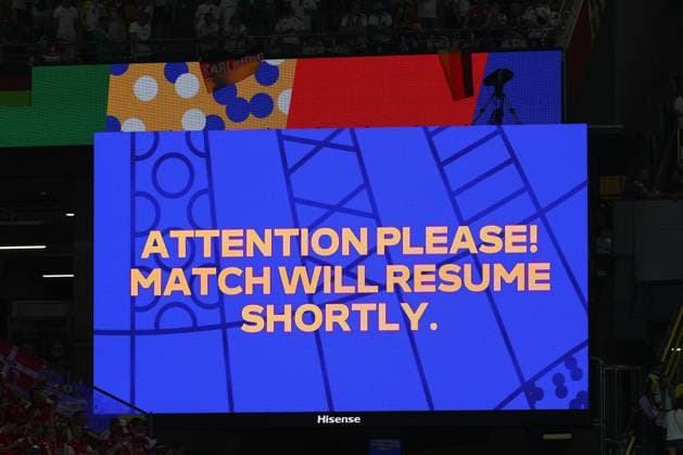 Euro 2024 Germany Denmark on 29 06 2024 at the BVB Stadion Dortmund in Dortmund The match was interrupted due to the weather on the scoreboard video screen Attention please Match will resume shortly MH