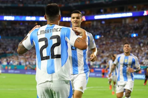 Argentina s forward Lautaro Martinez L celebrates with teammate Argentina s forward Valentin Carboni C after scoring the team™s second goal against Peru during the Copa America USA 2024, group A match between Argentina and Peru, at Hard Rock stadium in Miami, on June 29, 2024 MIAMI UNITED STATES Copyright: xALEJANDROxPAGNIx