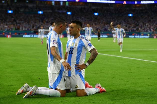 Argentina s forward Lautaro Martinez R celebrates with his teammate forward Angel Di Maria after scoring the team™s second goal against Peru during the Copa America USA 2024, group A match between Argentina and Peru, at Hard Rock stadium in Miami, on June 29, 2024 MIAMI UNITED STATES Copyright: xALEJANDROxPAGNIx
