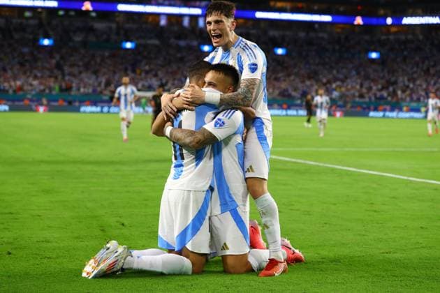 Argentina s forward Lautaro Martinez C hidden celebrates with his teammates forward Angel Di Maria and forward Alejandro Garcnacho R after scoring the team™s second goal against Peru during the Copa America USA 2024, group A match between Argentina and Peru, at Hard Rock stadium in Miami, on June 29, 2024 MIAMI UNITED STATES Copyright: xALEJANDROxPAGNIx