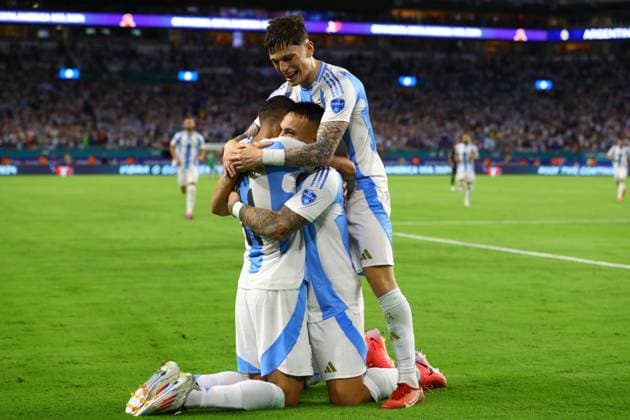 Argentina s forward Lautaro Martinez C hidden celebrates with his teammates forward Angel Di Maria and forward Alejandro Garcnacho R after scoring the team™s second goal against Peru during the Copa America USA 2024, group A match between Argentina and Peru, at Hard Rock stadium in Miami, on June 29, 2024 MIAMI UNITED STATES Copyright: xALEJANDROxPAGNIx