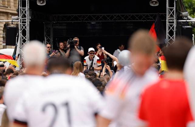 Germany Hesse Frankfurt am Main 23 06 2024 European Football Championship 2024 European Championship type with the saxophone, saxophonist in Völler jersey, Andre Schnura with the black saxophone Sport Public Viewing in Frankfurt