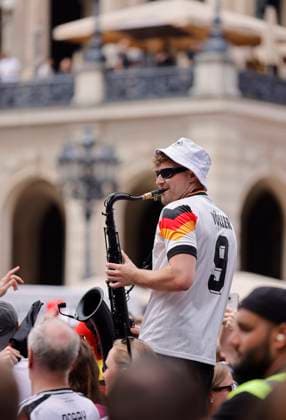 Germany Hesse Frankfurt am Main 23 06 2024 European Football Championship 2024 European Championship type with the saxophone, saxophonist in Völler jersey, Andre Schnura with the black saxophone Sport Public Viewing in Frankfurt