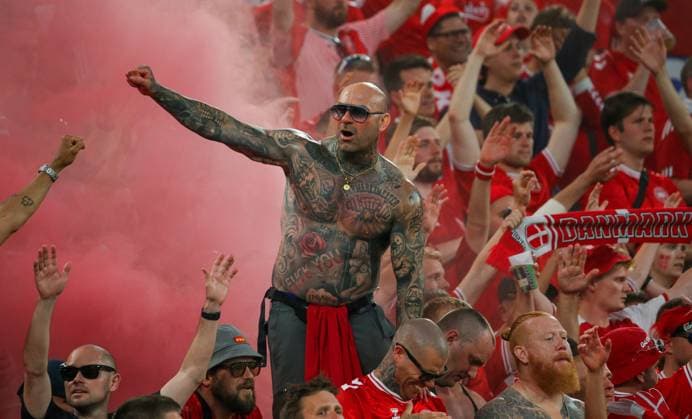 BAU 29 06 2024 Dortmund European Football Championship 2024 round of 16 Germany vs Denmark, Danish fan with tattoos in front of a red smoke bengalo