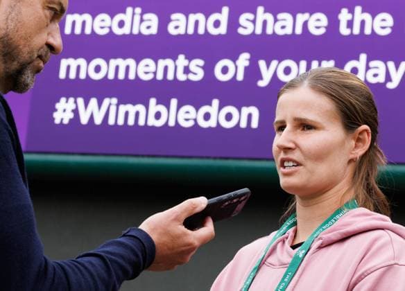 Belgian Greet Minnen is interviewed by former Belgian player Filip Dewulf prior to a training session during preparations ahead of the 2024 Wimbledon grand slam tennis tournament at the All England Tennis Club, in south-west London, Britain, Sunday 30 June 2024. BENOITxDOPPAGNE  x95551499x