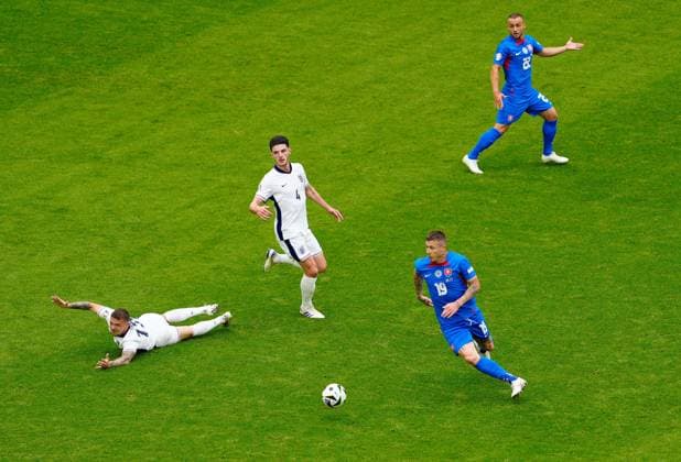 EURO 2024, England - Slowakei Juraj Kucka of Slovakia on the ball as Kieran Trippier of England appeals for a foul England v Slovakia, UEFA European Championship, EM, Europameisterschaft 2024, Round of 16, Football, Arena AufSchalke, Gelsenkirchen, Germany - 30 Jun 2024 EDITORIAL USE ONLY No use with unauthorised audio, video, data, fixture lists, club league logos or live services. Online in-match use limited to 120 images, no video emulation. No use in betting, games or single club league player publications. Copyright: xDavexShopland Shutterstockx 14562222ak