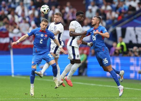 EURO 2024, England - Slowakei Gelsenkirchen, Germany, 30th June 2024. Peter Pekarik and Ivan Schranz of Slovakia combine against Kieran Trippier and Marc Guà hi of England during the UEFA European Championships round of 16 match at Arena Aufschalke, Gelsenkirchen. Picture credit should read: Paul Terry Sportimage EDITORIAL USE ONLY. No use with unauthorised audio, video, data, fixture lists, club league logos or live services. Online in-match use limited to 120 images, no video emulation. No use in betting, games or single club league player publications. SPI-3212-0048