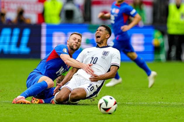 England v Slovakia Euro 2024 30 06 2024. Round of 16 Milan Skriniar of Slovakia brings down Jude Bellingham of England during the Round of 16 Euro 2024 match between England and Slovakia at Veltins Arena, Gelsenkirchen, Germany on 30 June 2024. Editorial use only , Copyright: xNigelxKeenex PSI-19907-0022