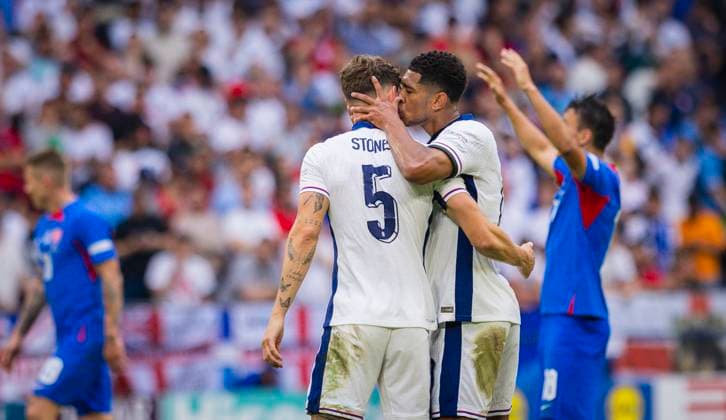 Gelsenkirchen, Germany 30th Jun 2024 Jude Bellingham ENG apologizes to John Stones ENG with a kiss England Slovakia England Slovakia 06 2024
