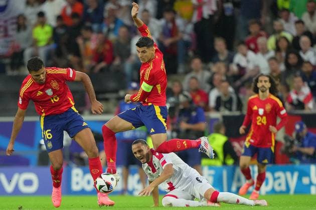 Spain s Rodri Spain s Alvaro Morata fight for the ball with Georgia s Budu Zivzivadze during the Euro 2024 soccer match between Spain and Georgia at the Cologne Stadium , Cologne , Germany - Sunday 30 June 2024. - Soccer .  Copyright: xSpada LaPressex