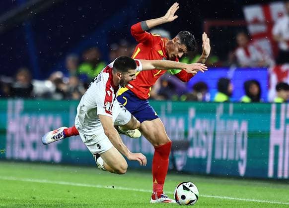 Luka Lochoshvili of Georgia is fouled by Ãlvaro Morata of Spain Spain v Georgia, UEFA European Championship, EM, Europameisterschaft 2024, Round of 16, Football, Cologne Stadium, Cologne, Germany - 30 Jun 2024 EDITORIAL USE ONLY No use with unauthorised audio, video, data, fixture lists, club league logos or live services. Online in-match use limited to 120 images, no video emulation. No use in betting, games or single club league player publications. Copyright: xMichaelxZemanek Shutterstockx 14562306x
