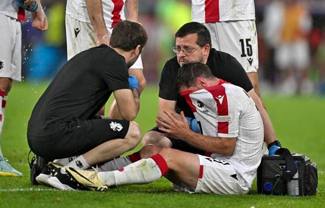 30 06 2024, Football UEFA EURO 2024, Round of 16, Spain Georgia, at Cologne Stadium, Otar Kiteishvili Georgia on the ground, receiving treatment