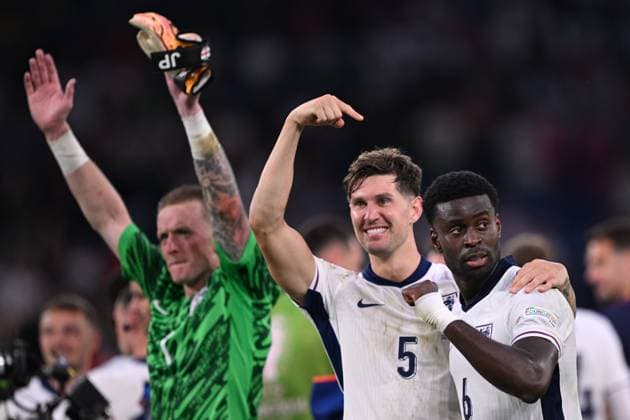 Germany Soccer Euro 2024 England - Slovakia 8720411 30.06.2024 From left, England s goalkeeper Jordan Pickford, England s John Stones and Marc Guehi celebrate their team s victory in the UEFA EURO, EM, Europameisterschaft,Fussball 2024 Round of 16 soccer match between England and Slovakia at the Veltins-Arena in Gelsenkirchen, Germany. Alexey Filippov Sputnik Gelsenkirchen Germany  Copyright: xAlexeyxFilippovx