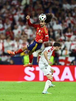 Marc Cucurella of Spain heads the ball as he jumps over Otar Kakabadze of Georgia Spain v Georgia, UEFA European Championship, EM, Europameisterschaft 2024, Round of 16, Football, Cologne Stadium, Cologne, Germany - 30 Jun 2024 EDITORIAL USE ONLY No use with unauthorised audio, video, data, fixture lists, club league logos or live services. Online in-match use limited to 120 images, no video emulation. No use in betting, games or single club league player publications. Copyright: xMichaelxZemanek Shutterstockx 14562306as
