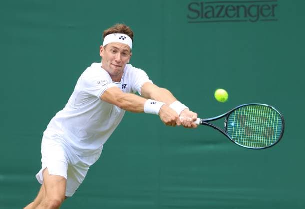 Norway s Casper Ruud plays a backhand in his first round match against Australian Alex Bolt on day one of the 2024 Wimbledon Championships in London on Monday, July 01, 2024.  LON2024070105 HUGOxPHILPOTT