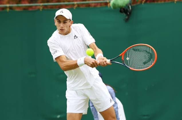 Italian Matteo Arnaldi plays a backhand in his first round match against American Frances Tiafoe on day one of the 2024 Wimbledon Championships in London on Monday, July 01, 2024.  LON2024070109 HUGOxPHILPOTT