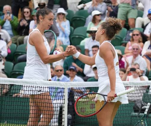 Lawn Tennis - 2024 Wimbledon Championship - Jasmine Paolini (ITA) v Sara Sorribes (ESP) - All England Lawn Tennis & Croquet Club - Monday 1st July 2024 Jasmine Paolini of Italy at the net with Sorribes after winning the match 