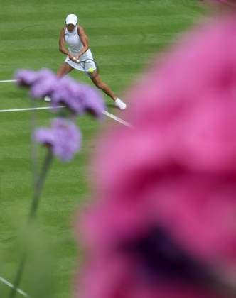 (240701) -- LONDON, July 1, 2024 -- Zhang Shuai competes during the women s singles first round match between Zhang Shuai of China and Daria Kasatkina of Russia at Wimbledon tennis Championship in London, Britain, on July 1, 2024. ) (SP)BRITAIN-LONDON-TENNIS-WIMBLEDON-DAY 1 HanxYan 