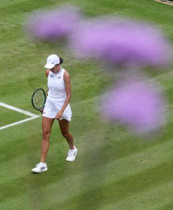 (240701) -- LONDON, July 1, 2024 -- Zhang Shuai reacts during during the women s singles first round match between Zhang Shuai of China and Daria Kasatkina of Russia at Wimbledon tennis Championship in London, Britain, on July 1, 2024. ) (SP)BRITAIN-LONDON-TENNIS-WIMBLEDON-DAY 1 HanxYan 