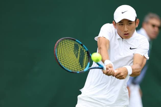 (240701) -- LONDON, July 1, 2024 -- Shang Juncheng hits a return during the men s singles first round match between Shang Juncheng of China and Cristian Garin of Chile at Wimbledon tennis Championship in London, Britain, on July 1, 2024. ) (SP)BRITAIN-LONDON-TENNIS-WIMBLEDON-DAY 1 LixYing 