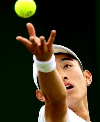 (240701) -- LONDON, July 1, 2024 -- Shang Juncheng serves the ball during the men s singles first round match between Shang Juncheng of China and Cristian Garin of Chile at Wimbledon tennis Championship in London, Britain, on July 1, 2024. ) (SP)BRITAIN-LONDON-TENNIS-WIMBLEDON-DAY 1 LixYing 
