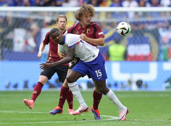 Dusseldorf, Germany, 1st July 2024. Marcus Thuram of France (L) is challenged by Wout Faes of Belgium during the UEFA European Championships Round of 16 match at Dusseldorf Arena, Dusseldorf. Picture credit should read: Paul Terry Sportimage EDITORIAL USE ONLY. No use with unauthorised audio, video, data, fixture lists, club league logos or live services. Online in-match use limited to 120 images, no video emulation. No use in betting, games or single club league player publications. SPI-3216-0038