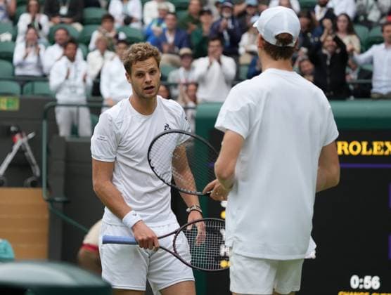 Lawn Tennis - 2024 Wimbledon Championship - Yannick Sinner (GER) v Yannick Hanfmann (GER) - All England Lawn Tennis & Croquet Club - Monday 1st July 2024 Yannick Sinner (GER) checks on Hanfmann after he fell over 