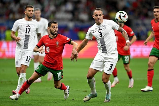 Football Euro 2024 Round of 16 01 07 2024 Portugal Slovenia Bernardo Silva left, Portugal v Jure Balkovec right, Slovenia