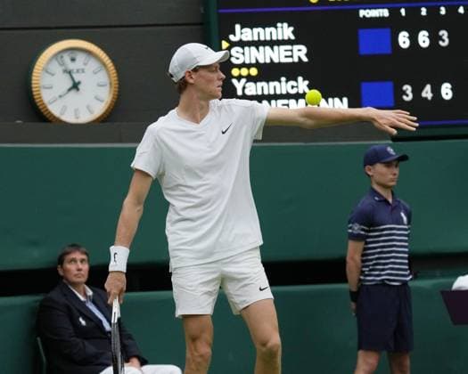 Lawn Tennis - 2024 Wimbledon Championship - Yannick Sinner (GER) v Yannick Hanfmann (GER) - All England Lawn Tennis & Croquet Club - Monday 1st July 2024 Yannick Sinner (GER) rolls the ball down his arm while he waits for the roof to close 