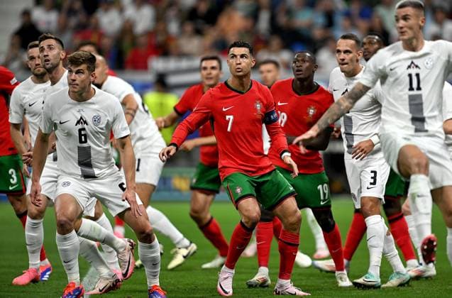 Football Euro 2024 Round of 16 01 07 2024 Portugal Slovenia Jaka Bijol left, Slovenia vs Cristiano Ronaldo center, Portugal vs Jure Balkovec right, Slovenia
