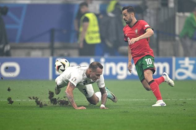 Football Euro 2024 Round of 16 01 07 2024 Portugal Slovenia Jure Balkovec left, Slovenia v Bernardo Silva right, Portugal