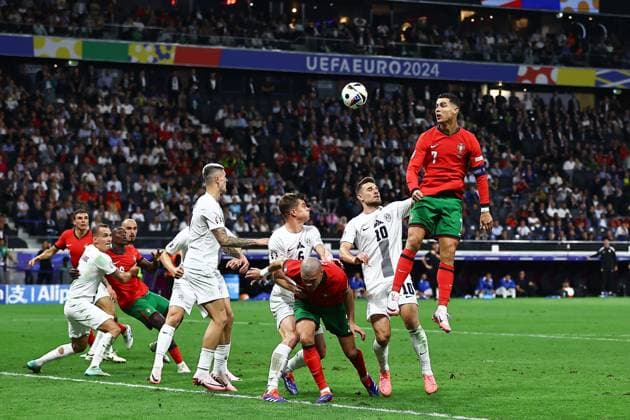 Cristiano Ronaldo of Portugal stretches for a header Portugal v Slovenia, UEFA European Championship, EM, Europameisterschaft 2024, Round of 16, Football, Frankfurt Arena, Frankfurt, Germany - 01 Jul 2024 EDITORIAL USE ONLY No use with unauthorised audio, video, data, fixture lists, club league logos or live services. Online in-match use limited to 120 images, no video emulation. No use in betting, games or single club league player publications. Copyright: xMichaelxZemanek Shutterstockx 14566640cc