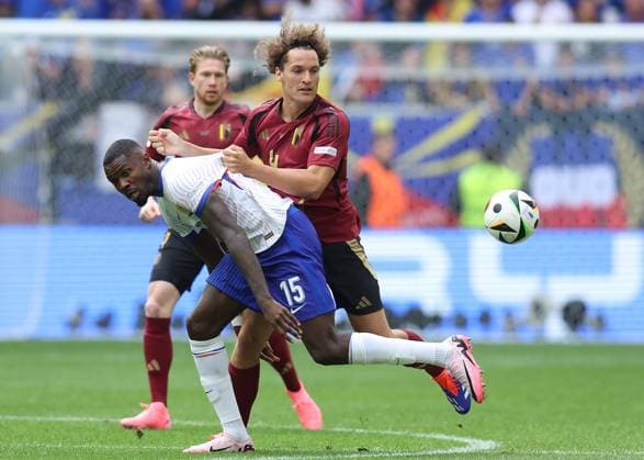 Dusseldorf, Germany, 1st July 2024. Marcus Thuram of France and Wout Faes of Belgium challenge for the ball during the UEFA European Championships Round of 16 match at Dusseldorf Arena, Dusseldorf. Picture credit should read: Paul Terry Sportimage EDITORIAL USE ONLY. No use with unauthorised audio, video, data, fixture lists, club league logos or live services. Online in-match use limited to 120 images, no video emulation. No use in betting, games or single club league player publications. SPI-3216-0247
