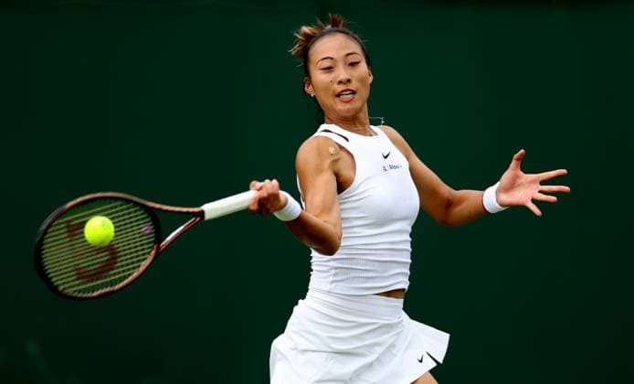 (240702) -- LONDON, July 2, 2024 -- Zheng Qinwen hits a return during the women s singles first round match between Zheng Qinwen of China and Sun Lulu of New Zealand at Wimbledon tennis Championship in London, Britain, on July 1, 2024. ) (SP)BRITAIN-LONDON-TENNIS-WIMBLEDON LixYing 