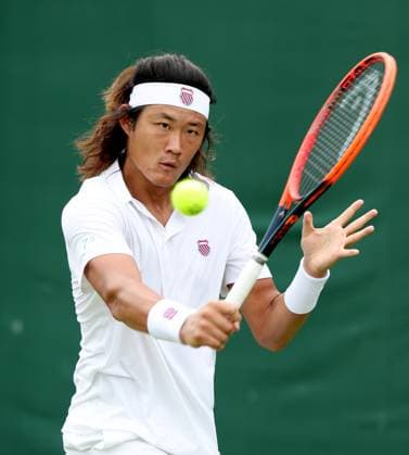 (240702) -- LONDON, July 2, 2024 -- Zhang Zhizhen hits a return during the men s singles first round match between Zhang Zhizhen of China and Maxime Janvier of France at Wimbledon tennis Championship in London, Britain, on July 1, 2024. ) (SP)BRITAIN-LONDON-TENNIS-WIMBLEDON LixYing 