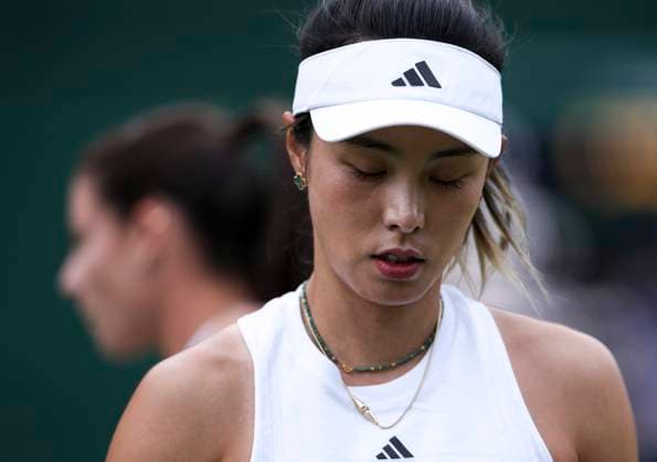 (240702) -- LONDON, July 2, 2024 -- Wang Qiang reacts during the women s singles first round match between Wang Qiang of China and Emma Navarro of the United States at Wimbledon tennis Championship in London, Britain, on July 1, 2024. ) (SP)BRITAIN-LONDON-TENNIS-WIMBLEDON HanxYan 