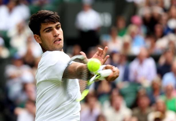 (240702) -- LONDON, July 2, 2024 -- Carlos Alcaraz hits a return during the men s singles first round match between Carlos Alcaraz of Spain and Mark Lajal of Estonia at Wimbledon tennis Championship in London, Britain, on July 1, 2024. ) (SP)BRITAIN-LONDON-TENNIS-WIMBLEDON LixYing 