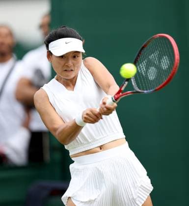 (240702) -- LONDON, July 2, 2024 -- Wang Yafan hits a return during the women s singles first round match between Wang Yafan of China and Anna Karolina Schmiedlova of Slovakia at Wimbledon tennis Championship in London, Britain, on July 1, 2024. ) (SP)BRITAIN-LONDON-TENNIS-WIMBLEDON LixYing 