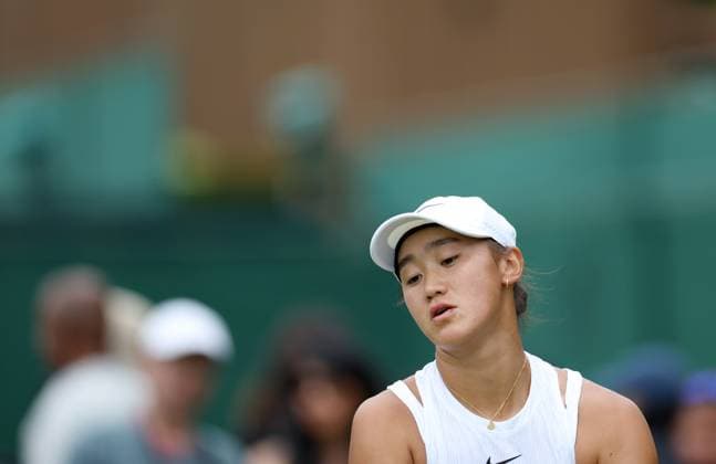 (240702) -- LONDON, July 2, 2024 -- Wang Xiyu reacts during the women s singles first round match between Wang Xiyu of China and Donna Vekic of Croatia at Wimbledon tennis Championship in London, Britain, on July 1, 2024. ) (SP)BRITAIN-LONDON-TENNIS-WIMBLEDON LixYing 